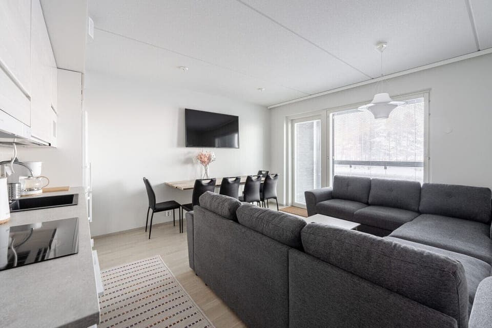 A bright and inviting open-plan living space, designed for comfort and socializing.