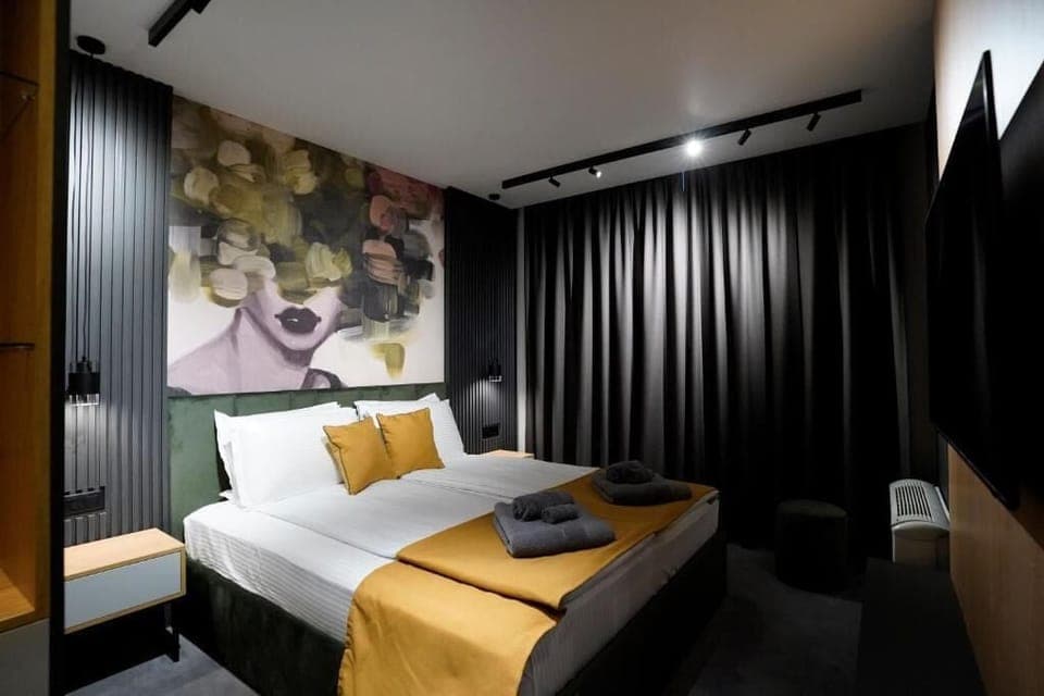 Deluxe Double Room, City View | Blackout drapes, soundproofing, iron/ironing board, free WiFi