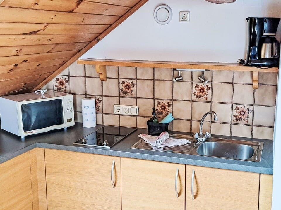 Kitchen, Wood, Countertop, Flooring, Interior Design, Kitchen Appliance, Kitchen Sink, Floor, Furniture, Cabinetry