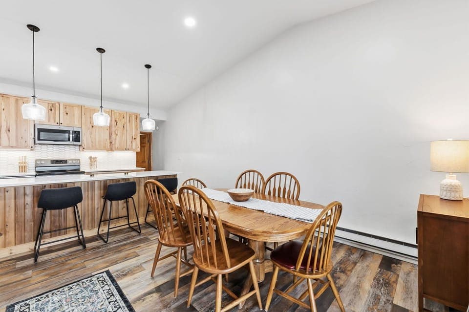 Gather around your spacious dining table for memorable meals in this warm, modern space with beautiful wood accents.