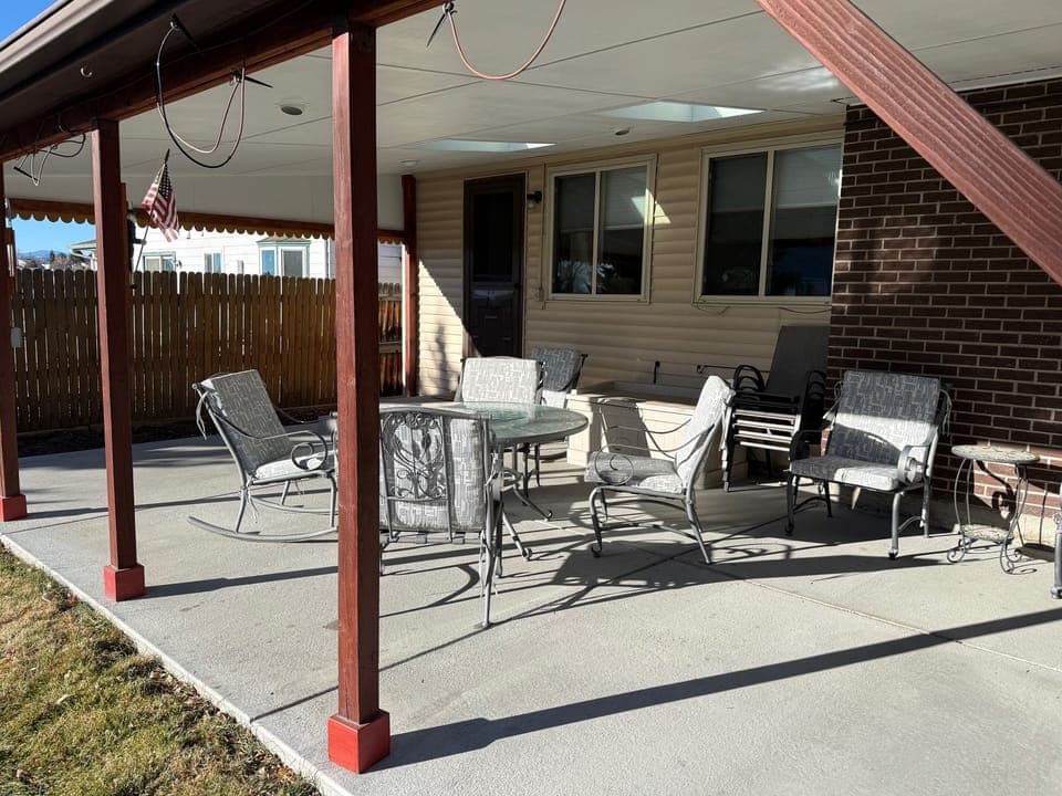 Covered Patio with table, chairs, and additional seating