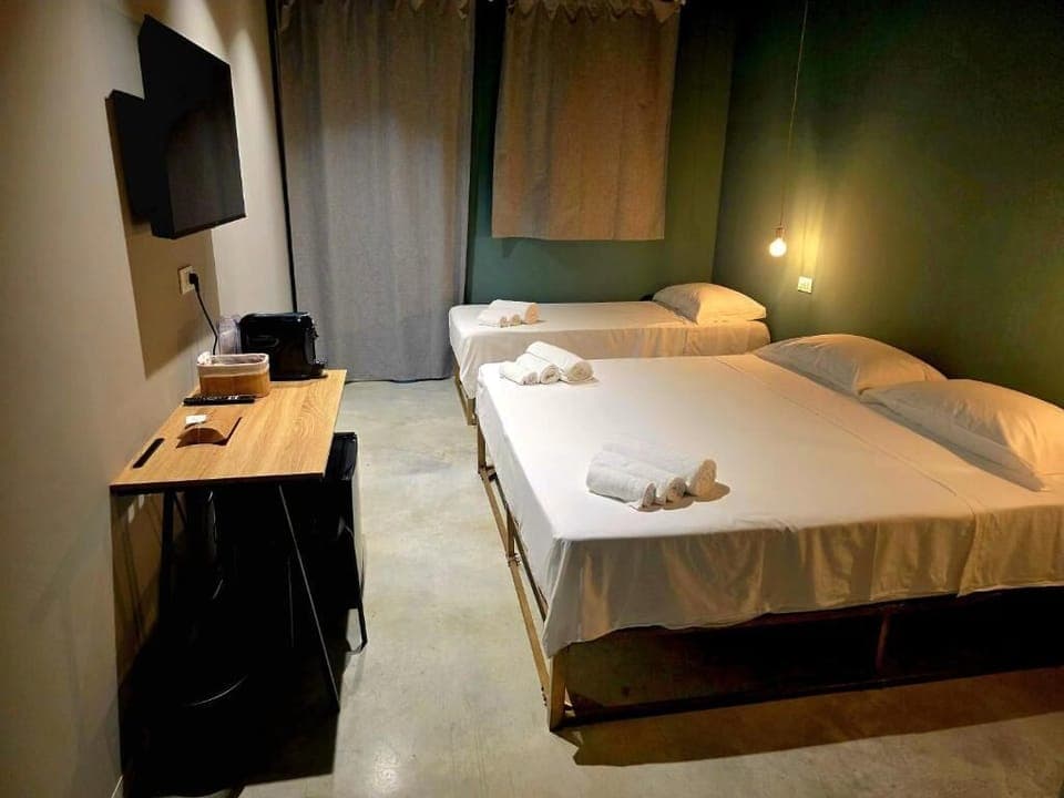 Family Quadruple Room, Patio | In-room safe, laptop workspace, soundproofing, free WiFi