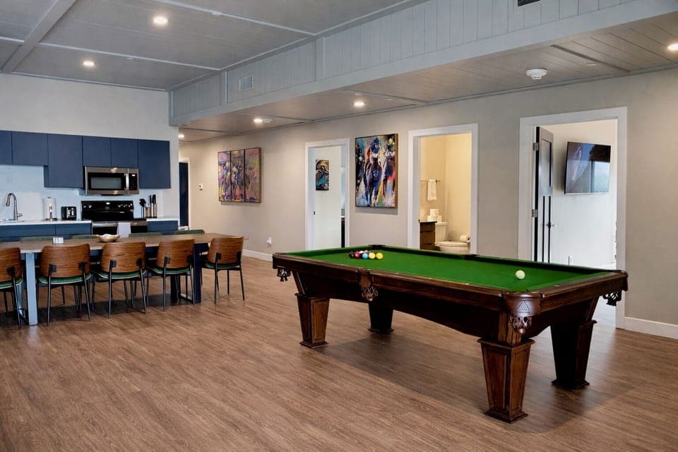 Cook up a feast while staying connected to the fun happening around the classic wooden pool table. The open design means the chef never has to miss out on the party.