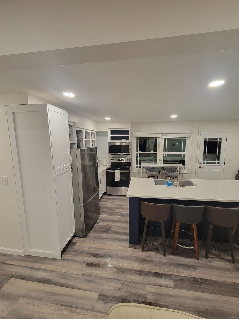 Kitchen with new appliances and large pantry cabinet