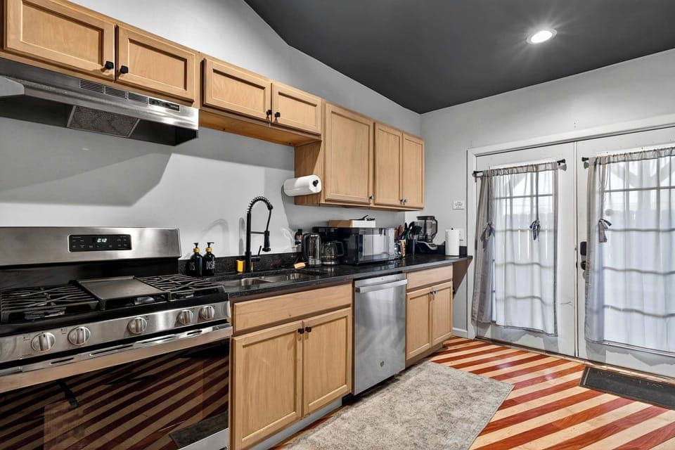 Kitchen 1: The kitchen in Unit 1 offers a modern, well-equipped space perfect for preparing meals.