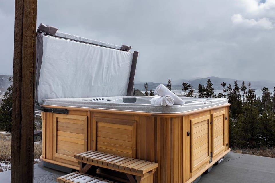 Soak your worries away in this private hot tub at 224 GCR 4034 , complete with fluffy towels and stunning mountain views for the ultimate relaxation.