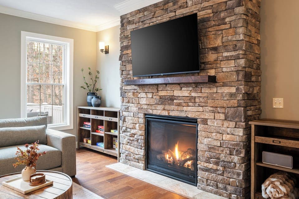 Cozy up by the fireplace on our custom Crate & Barrel sectional
