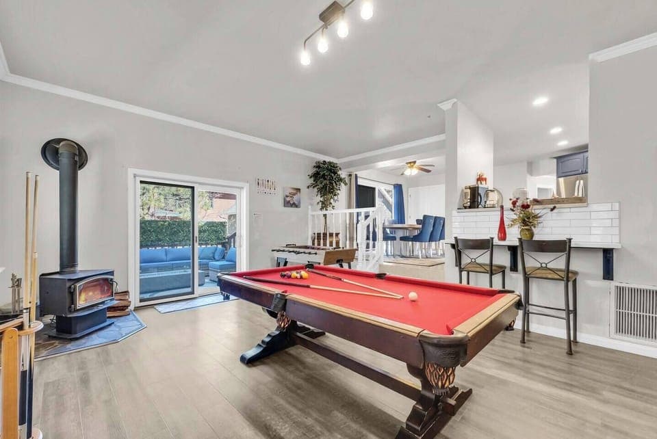 Fun-filled game area with pool table and open-concept living space