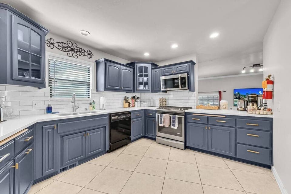 Fully stocked kitchen with modern appliances and plenty of counter space