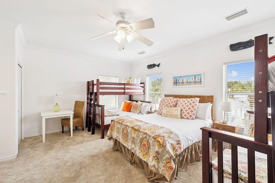 Your spacious bedroom combines comfort and fun with a queen bed and bunk beds, perfect for families or groups sharing memorable stays together.