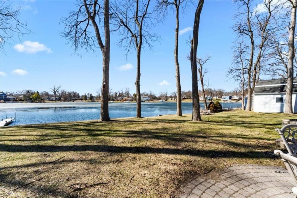A wide open yard and calm water views make this the kind of place you slow down without even trying.