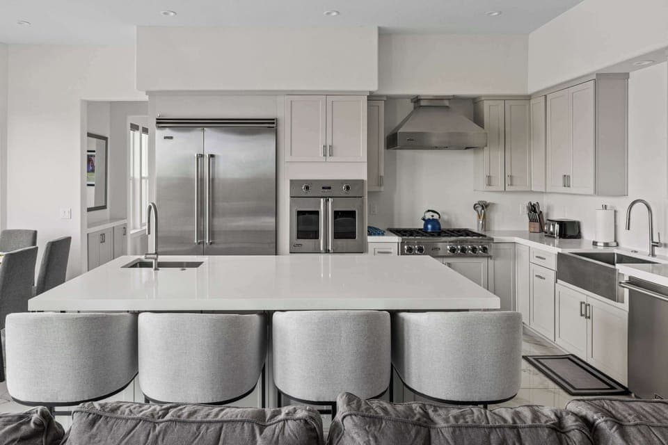Seating for four at the massive kitchen island, perfectly positioned for conversation.