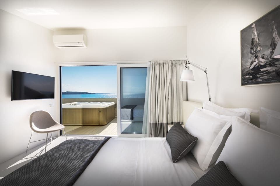 Luxury Suite, Sauna, Sea View | Premium bedding, minibar, in-room safe, desk