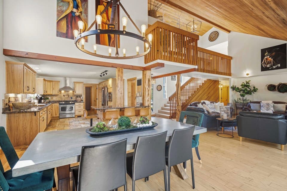 Gather around your spacious dining table while the chef prepares meals in your fully-equipped kitchen, all under soaring vaulted ceilings.