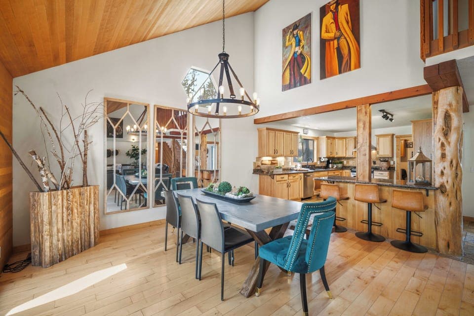 Savor memorable meals in your elegant dining space with exposed beams, modern fixtures, and an open kitchen.