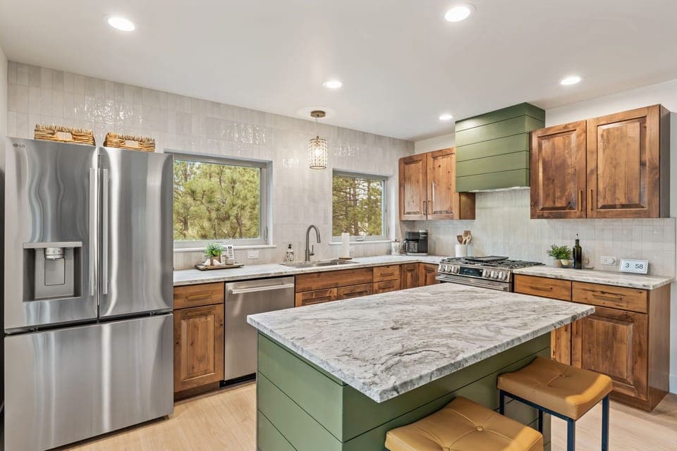 Refrigerator with water and ice dispenser, extra ice maker in freezer. 