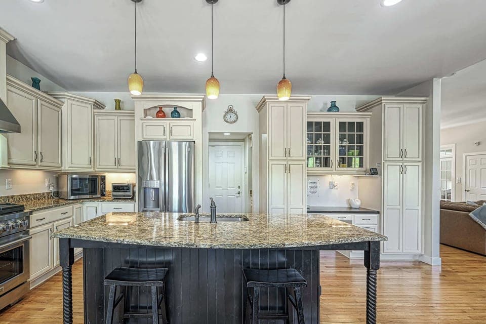 Kitchen - Island and range from another angle, showing the layout for prep and gathering.
