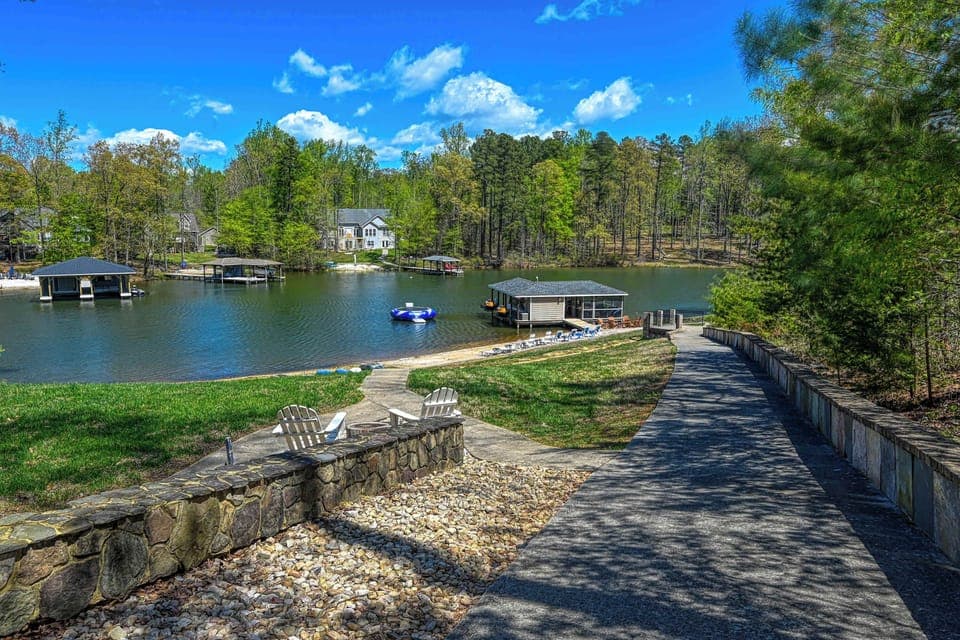 Lakefront - Stone retaining wall and dock seen from above the bank, the path down to the water.