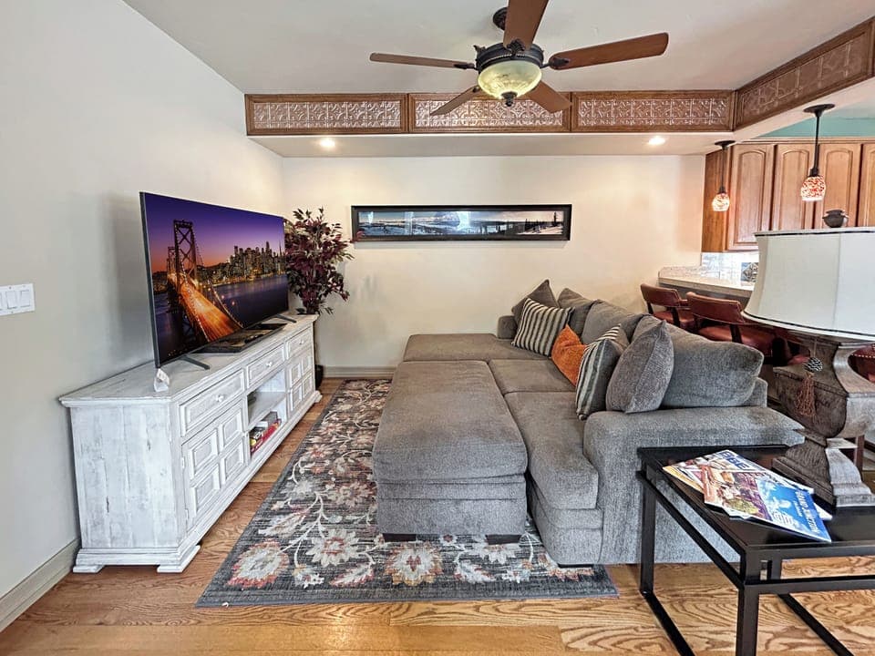 Unwind in your spacious living area with plush sectional seating, large flat-screen smart TV.