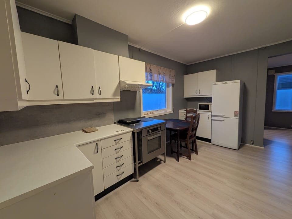 microwave, indoor dining, kitchen, oven, refrigerator, stovetop, dining table