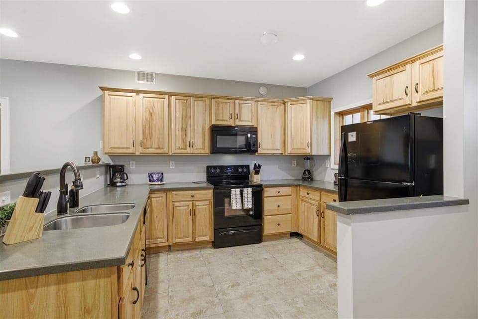 The kitchen invites you in with an open, welcoming feel, giving you the space to cook, connect, and keep the conversation going as meals come together effortlessly.
