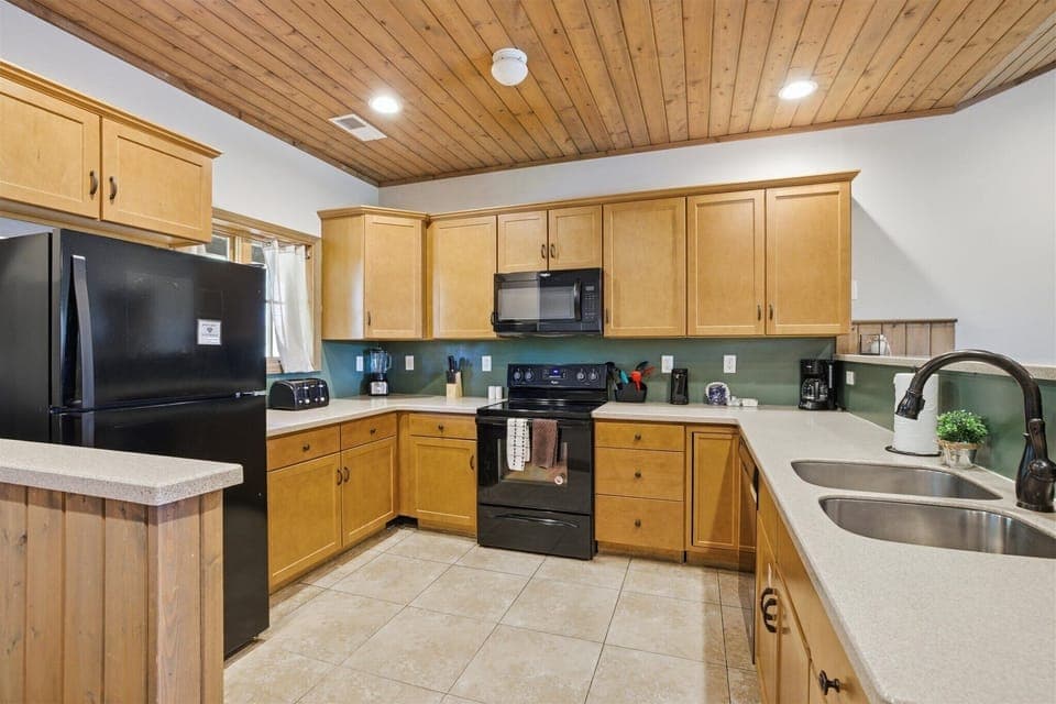 The kitchen invites you in with an open, welcoming feel, giving you the space to cook, connect, and keep the conversation going as meals come together effortlessly.