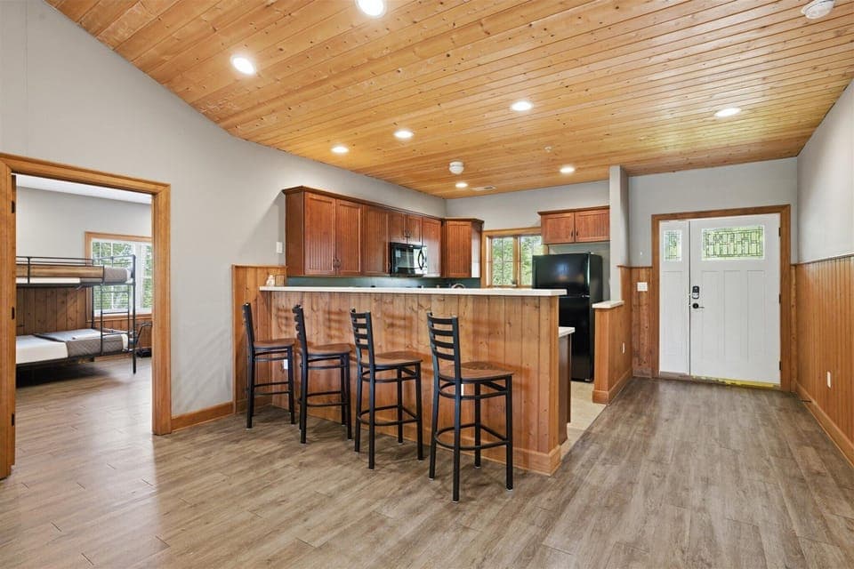 From the entry, the space opens wide into the kitchen, dining, and living areas, creating an immediate sense of connection and room to settle in without missing a beat.