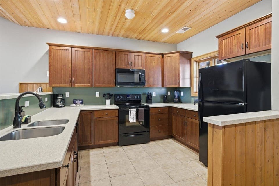 Designed for group living, the kitchen keeps everything within reach, so meals come together smoothly and no one feels tucked away from the moment.