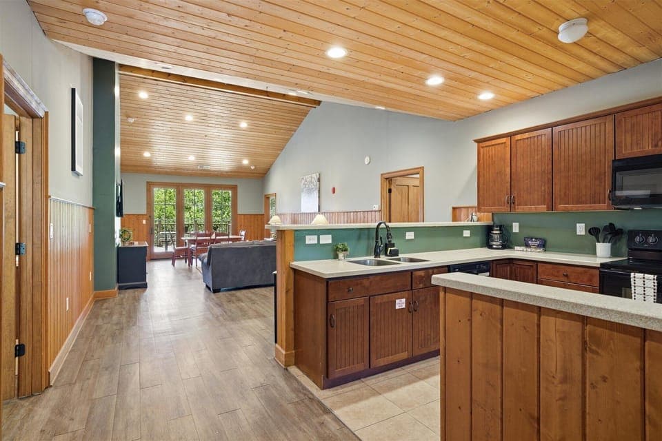 The kitchen opens up with space to move, prep, and gather, making it easy to cook for a crowd while staying right in the middle of the conversation.