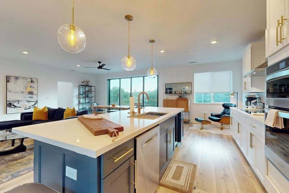 Channel your inner winemaker at this quartz-topped island with designer pendant lights — a fully equipped kitchen ready for your Sonoma Market haul.