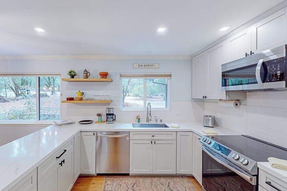 Rinse your Glen Ellen Village Market finds at the farmhouse sink while natural light streams in — your dishwasher handles cleanup so you can get back to relaxing.