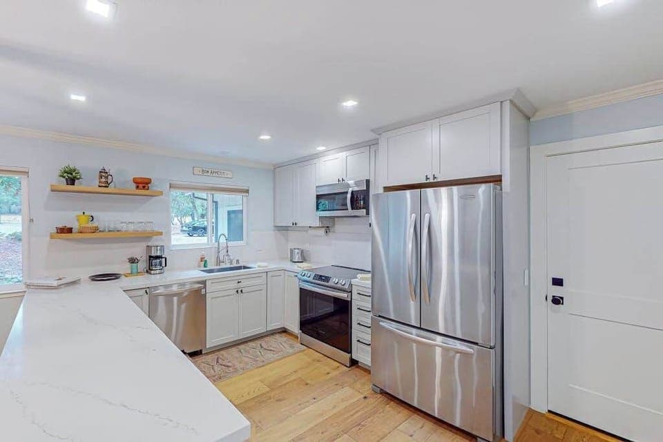 Cook like a local in your fully equipped kitchen featuring stainless steel appliances, quartz countertops, and open shelving — everything you need for a wine country dinner party.