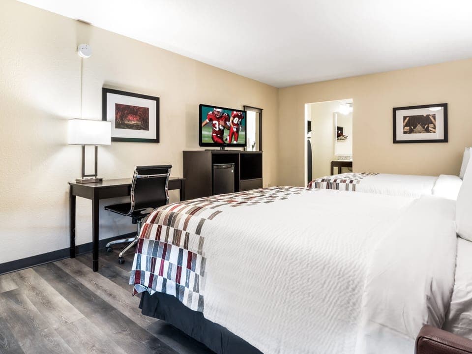 Desk, laptop workspace, blackout drapes, iron/ironing board