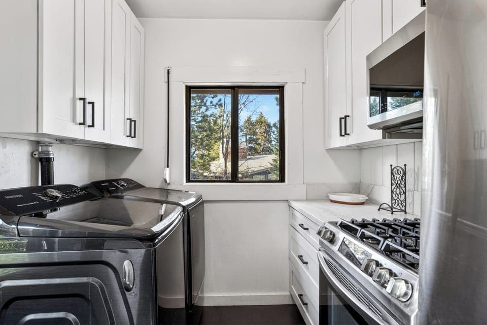 Bright kitchen workspace with a scenic window view to make meal prep a breeze.