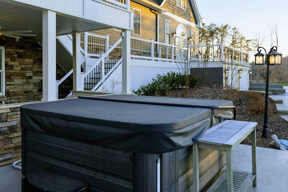 Hot Tub - A wood-trimmed soaker on the lower patio, tucked below the deck for quiet evenings after a day on the water.