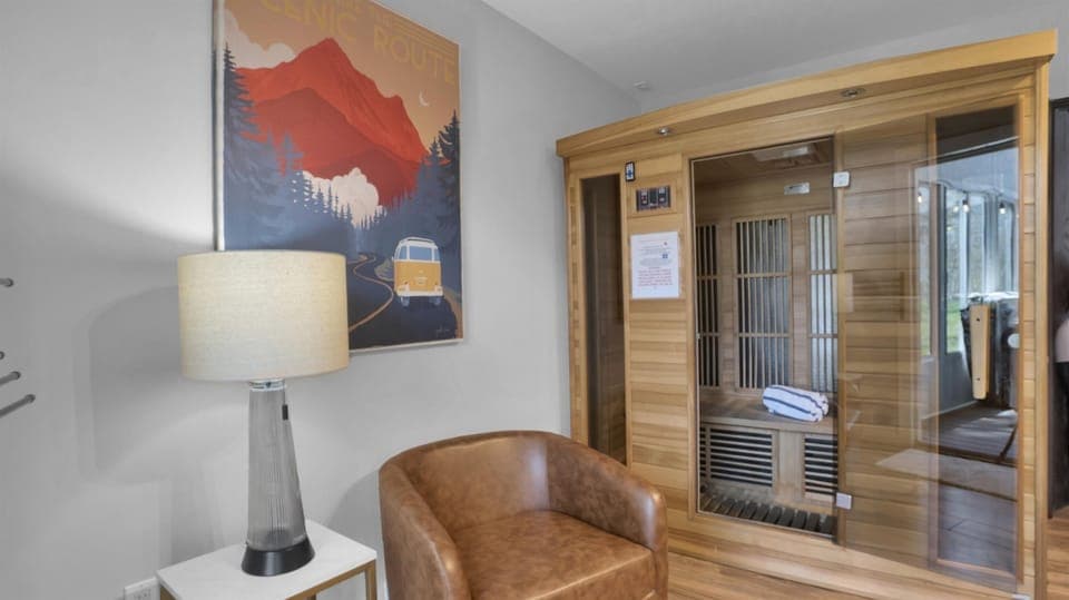 Step into the wood-wrapped sauna and let tension melt as warmth hugs every muscle.