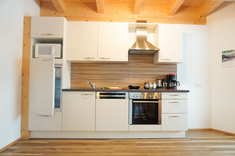 Family Apartment, 2 Bedrooms, Kitchen, Courtyard View | Private kitchen | Full-size fridge, microwave, oven, stovetop