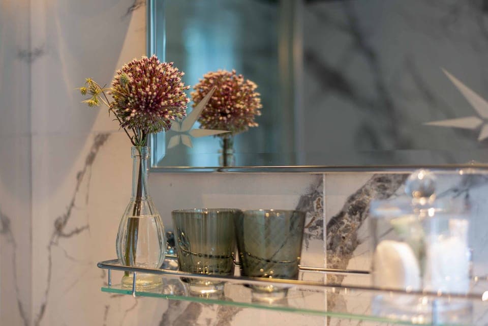 Shower, designer toiletries, hair dryer, bathrobes