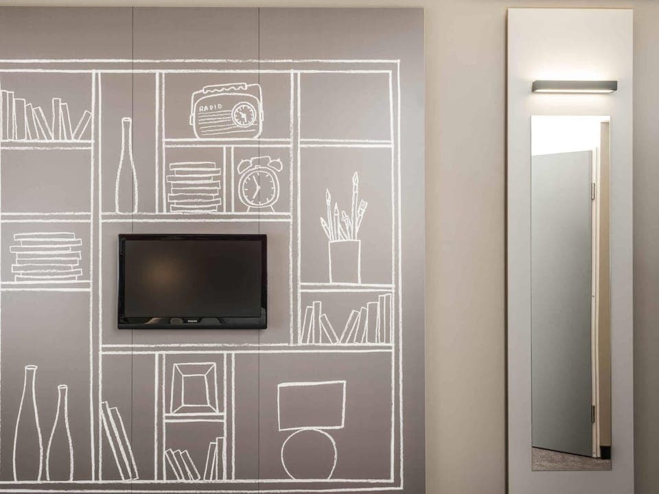 Desk, blackout drapes, soundproofing, free cribs/infant beds