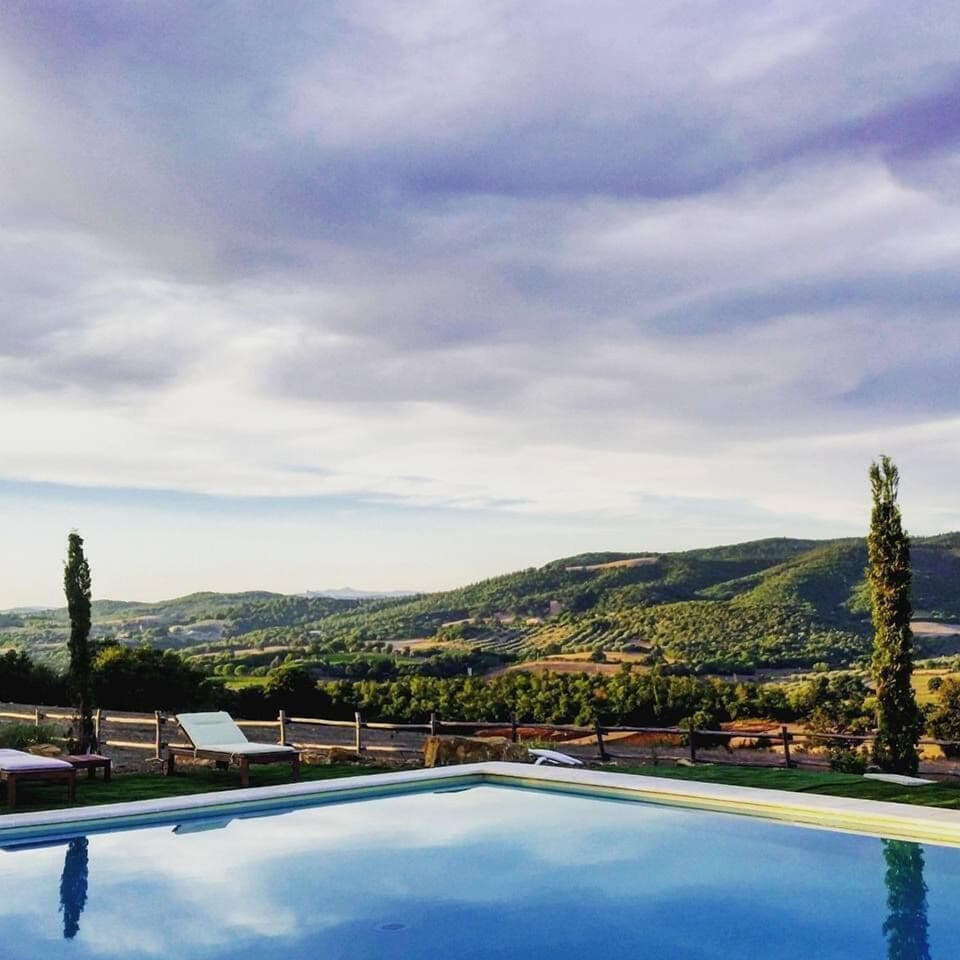 Seasonal outdoor pool, an infinity pool, pool umbrellas, sun loungers