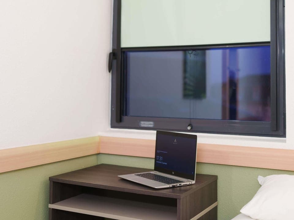 Desk, blackout drapes, soundproofing, free WiFi