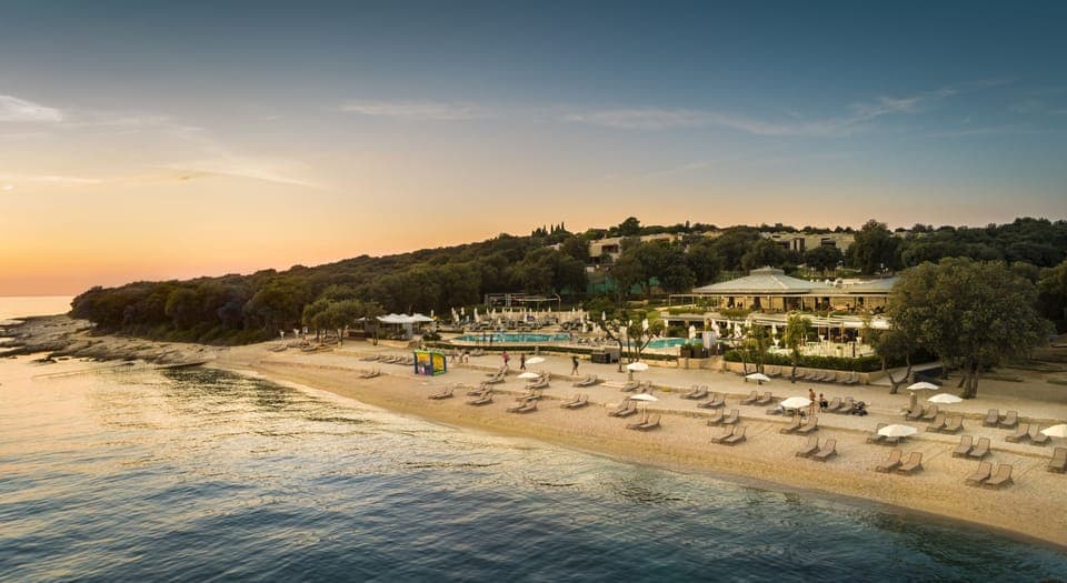 On the beach, sun loungers, beach umbrellas, water skiing