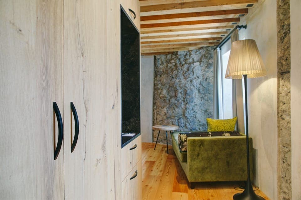 Deluxe Double Room | Living area | Flat-screen TV, first-run movies, heated floors