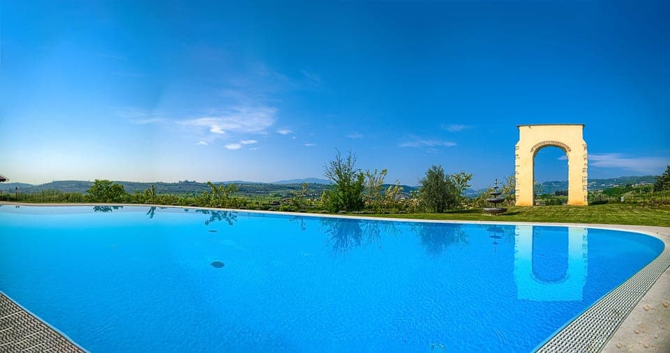 Outdoor pool, a rooftop pool, pool umbrellas, sun loungers