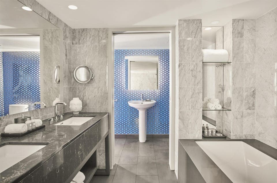 Shower, designer toiletries, hair dryer, towels