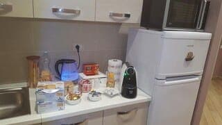 Fridge, electric kettle, cookware/dishes/utensils