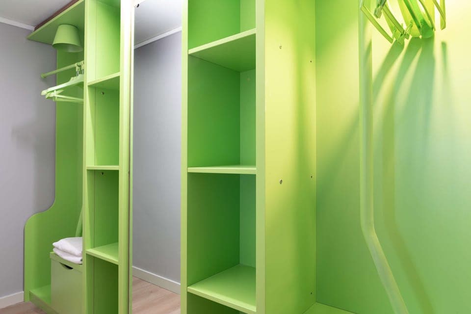 Premium bedding, desk, laptop workspace, blackout drapes