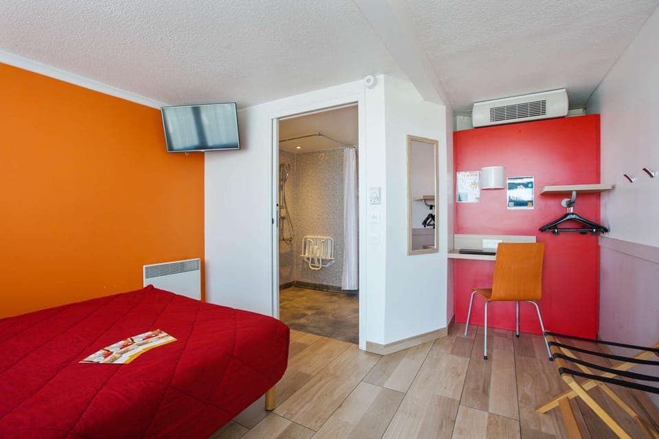 Comfort Room (accessible) | 1 bedroom, desk, blackout drapes, iron/ironing board