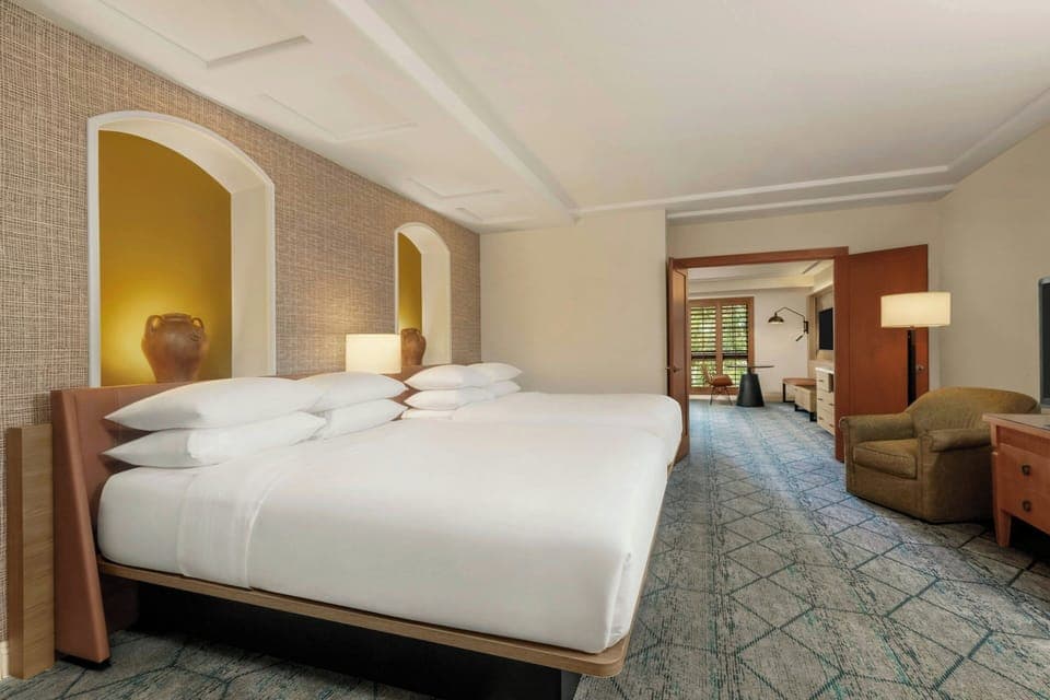 Down comforters, pillowtop beds, in-room safe, desk