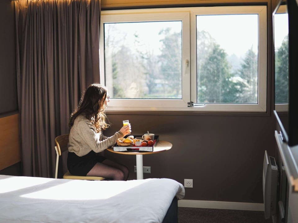 Premium bedding, desk, laptop workspace, blackout drapes